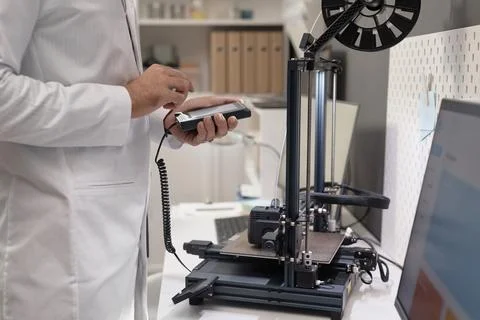 3D Printer Engineer Adjusting Settings Stock Photos