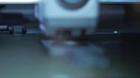 3D printer extruding filament while printing an object Stock Footage 345700685