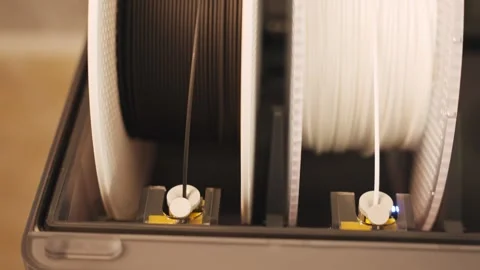 3D Printer Filament Spools Feeding Material Inside Machine Stockbeeldmateriaal 337190954