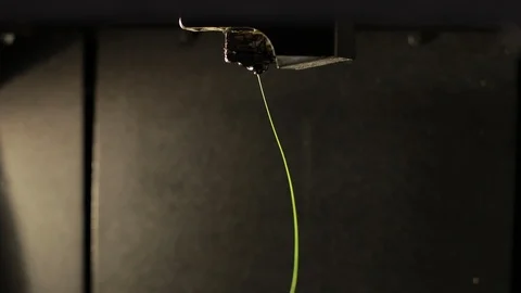 3D printer head prints yellow green plastic thread wire. Stock Footage 124891208