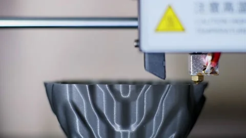 3d printer with hot tip applies plastic making stylish cup Stock Footage 140656041