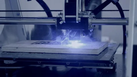 3D printer laser beam burns pattern close-up on wooden board. Stock Footage 98671236