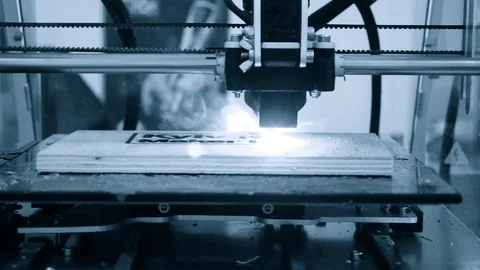 3d printer laser beam burns the pattern close-up on a wooden board Stock Footage 99191273