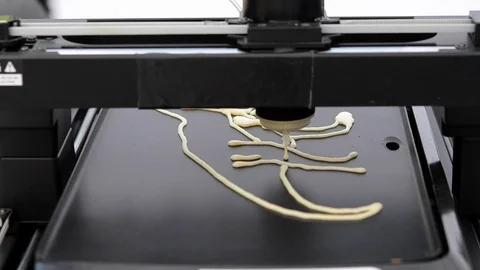 3D printer for liquid dough. 3D printer printing pancakes Stock Footage 90377458