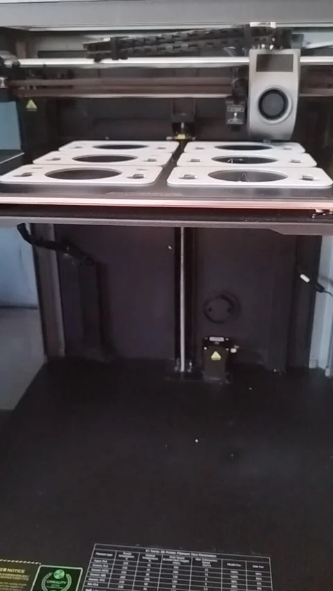 3D printer machining several plastic parts in series Stock Footage 284986846