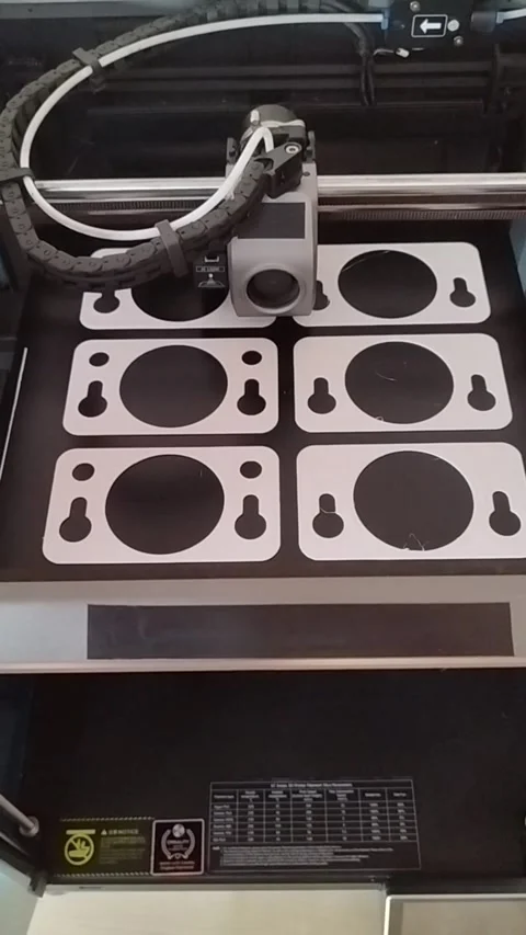 3D printer machining several plastic parts in series Stock Footage 285173156