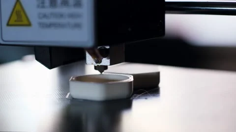 3d printer makes item applying hot plastic layers in shop 库存影片 140838413