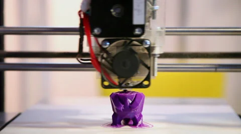 3D printer making a toy, industrial robot puts successive layers of plastic Stock Footage 38293713