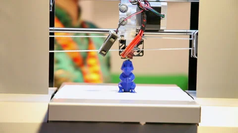 3D printer making a toy, three-dimensional, industrial robot Stock Footage 38291632