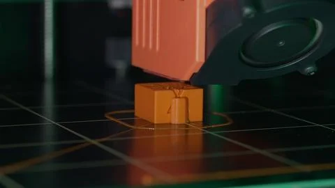 A 3D printer masterfully brings to life a spare part of your order. The process Stock Photos