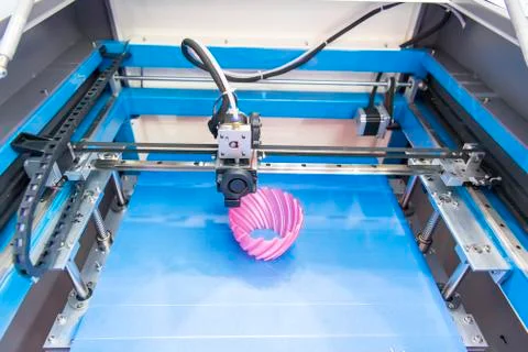 3D printer or additive manufacturing and robotic automation technology. Stock Photos