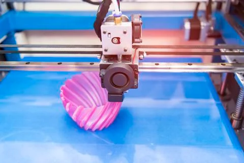 3D printer or additive manufacturing and robotic automation technology. Stock Photos