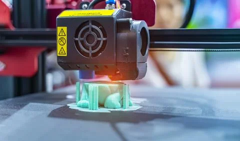 3D printer or additive manufacturing and robotic automation technology. Stock Photos