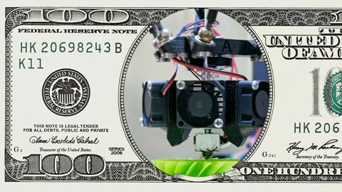 3D printer performs in frame of 100 dollar bill Stock Footage 96343792