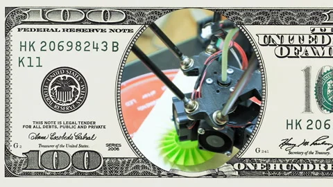 3D printer performs in frame of 100 dollar bill Stock Footage 97197391