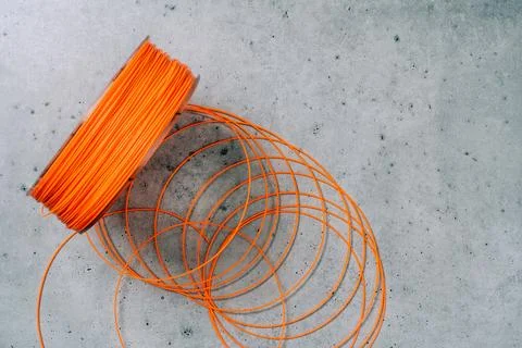 3d Printer Plastic Filament. Spool of orange  thermoplastic wire for 3D pri.. Stock Photos