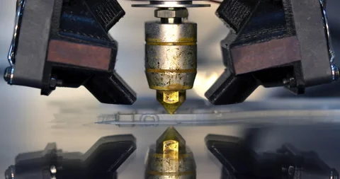 3D printer print isolated objects on mirror reflective surface close-up. Stock Footage 150488457
