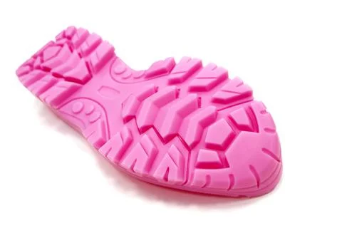 3D printer printed pink shoe soles in natural size isolated on white background Stock Photos