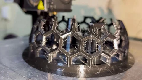 3D Printer Printing Black Plastic Hexagonal Mesh Object Stock Footage 341344627