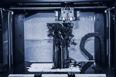 3D printer printing black shapes close-up Automatic three dimensional 3d printer Stock Photos