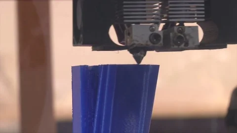 3D printer printing blue object Stock Footage 81448266