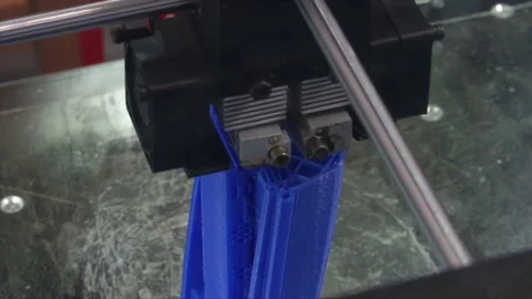 3D printer printing blue object Stock Footage 81448744