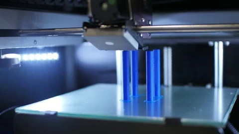 3d printer is printing blue plastic details. 3d printing project concept Stock Footage 94772139