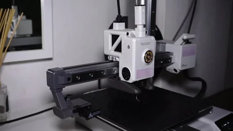 3D Printer Printing, Cleaning Nozzle, and Extruding Filament Stock Footage 300874873