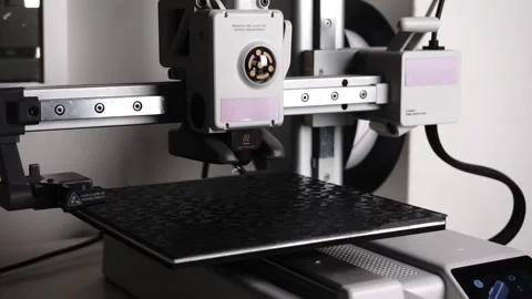 3D Printer Printing, Cleaning Nozzle, and Extruding Filament Stock Footage 300874898