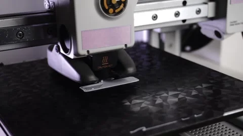 3D Printer Printing, Cleaning Nozzle, and Extruding Filament Stock Footage 300875034