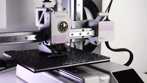 3D Printer Printing, Cleaning Nozzle, and Extruding Filament Stock Footage 300875050