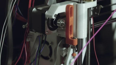 3d printer printing cu to its parts and the filament used Stock Footage 74501633
