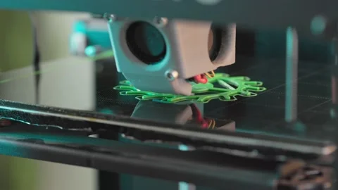 The 3d printer is printing a gear from green plastic. A layer by layer appears Stock Footage 236303393