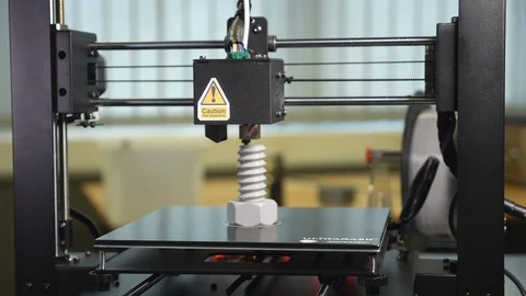 3D printer printing a gray screw Stock Footage 104182331