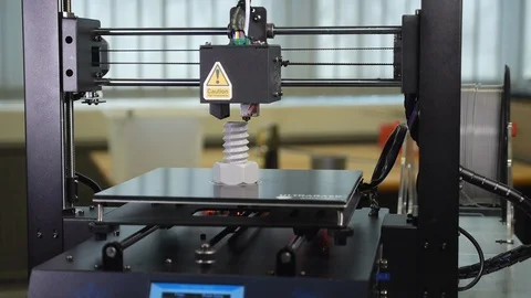 3D printer printing a gray screw Stock Footage 104182869