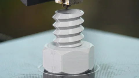 3D printer printing a gray screw Stock Footage 104183743