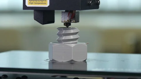 3D printer printing a gray screw Stock Footage 104185023