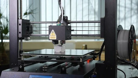 3D printer printing a gray screw Stock Footage 104186166