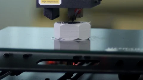 3D printer printing a gray screw Stock Footage 104186242