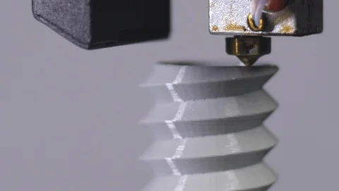 3D printer printing a gray screw, White background Stock Footage 104190868
