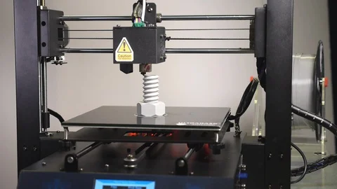 3D printer printing a gray screw, White background Stock Footage 104191405