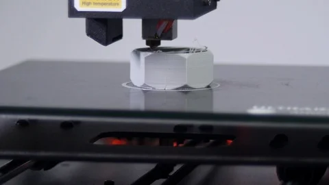 3D printer printing a gray screw, White background Stock Footage 104192917