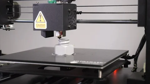3D printer printing a gray screw, White background Stock Footage 104192996
