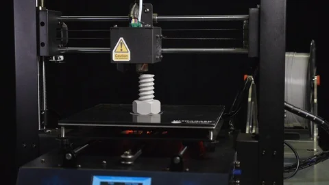 3D printer printing a gray screw, Black background Stock Footage 104193273
