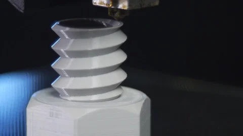 3D printer printing a gray screw, Black background Stock Footage 104194979