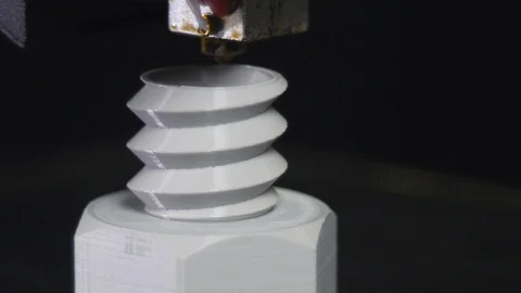 3D printer printing a gray screw, Black background Stock Footage 104195164