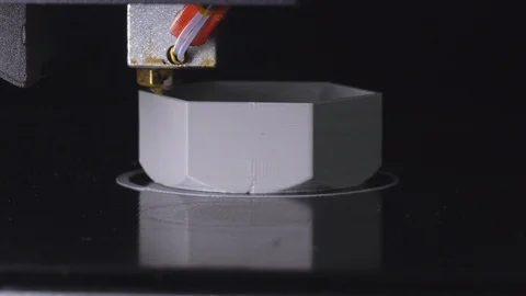 3D printer printing a gray screw, Black background Stock Footage 104195419