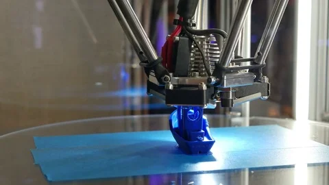 3D printer printing a little blue model boat, new printing technology Stock Footage 80939797