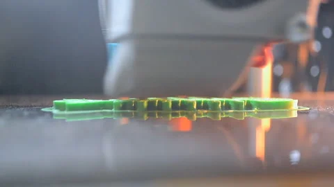 3D printer printing an object A 3D printer printing object from molten plastic Stock Footage 328700344