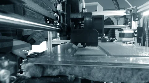 3D printer printing an object A 3D printer printing object from molten plastic Stock Footage 328700939